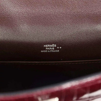 Hermès Paris stamp on burgundy handbag interior leather lining