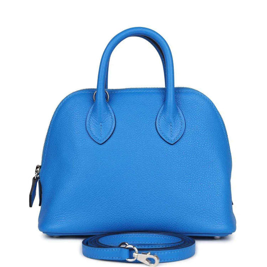 Mini Bolide bag in bright blue textured leather with top handles and crossbody strap