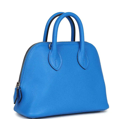 Mini Bolide bag in bright blue textured leather, front view with top handles