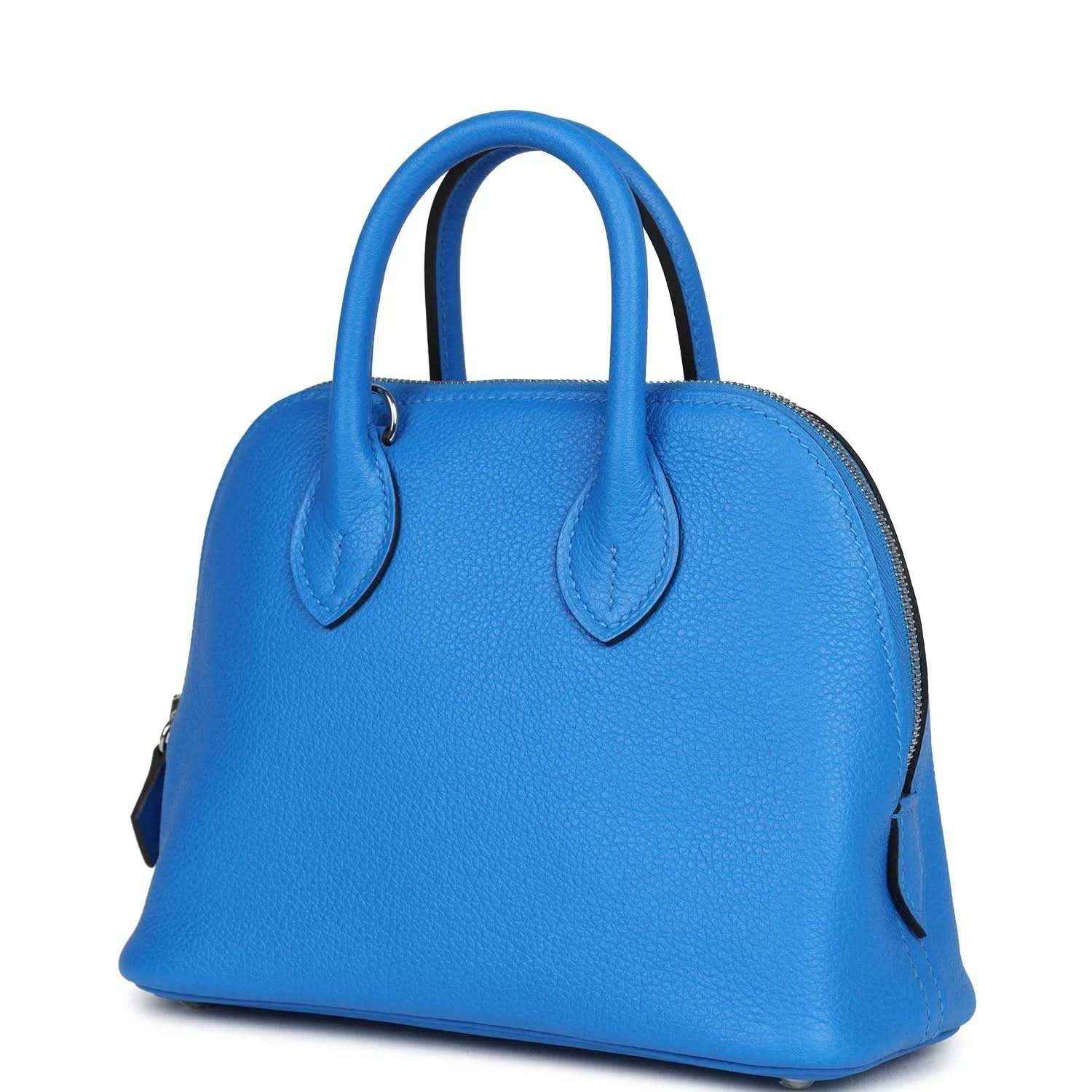 Mini Bolide bag in bright blue textured leather with top handles and curved side profile