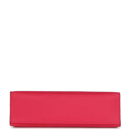 Pink leather pochette-style clutch with stitched edges and flat panel