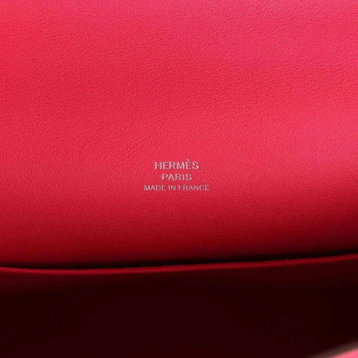 Hermès logo embossing on pink leather