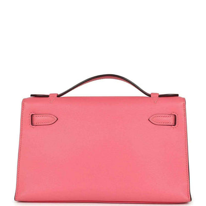 Hermes Kelly pochette bag in rose pink leather with top handle and front flap