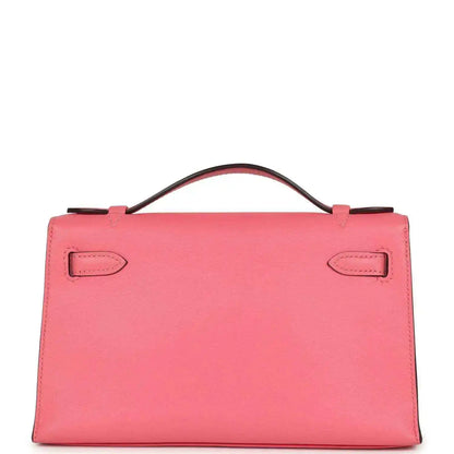 Hermes Kelly pochette bag in rose pink leather with top handle and front flap
