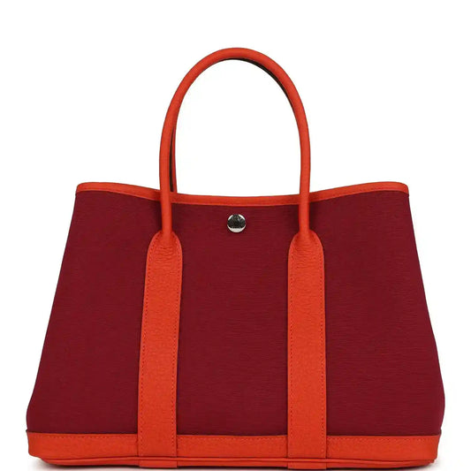Rubis canvas and leather tote bag with two top handles and front metal snap