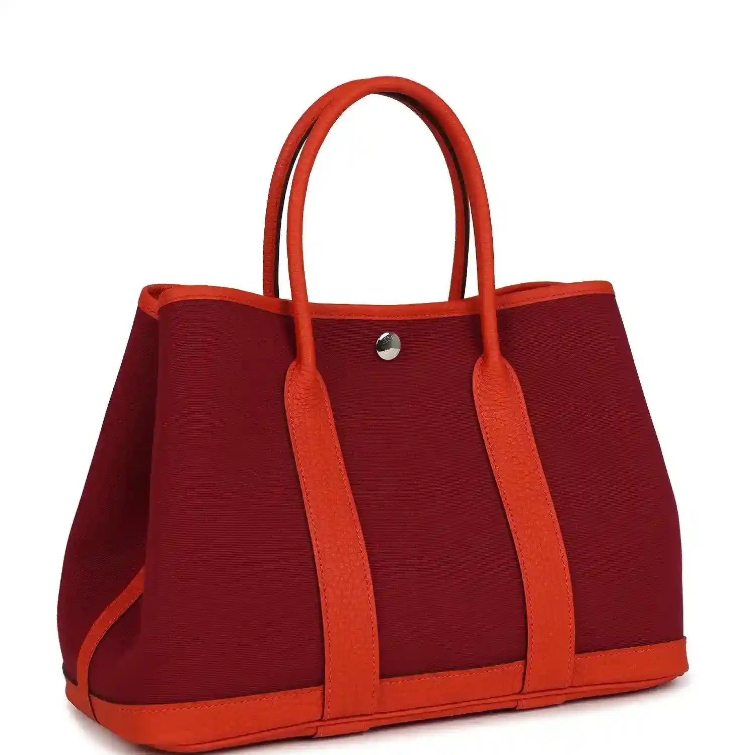 Rubis canvas tote bag with orange leather top handles and metal snap closure