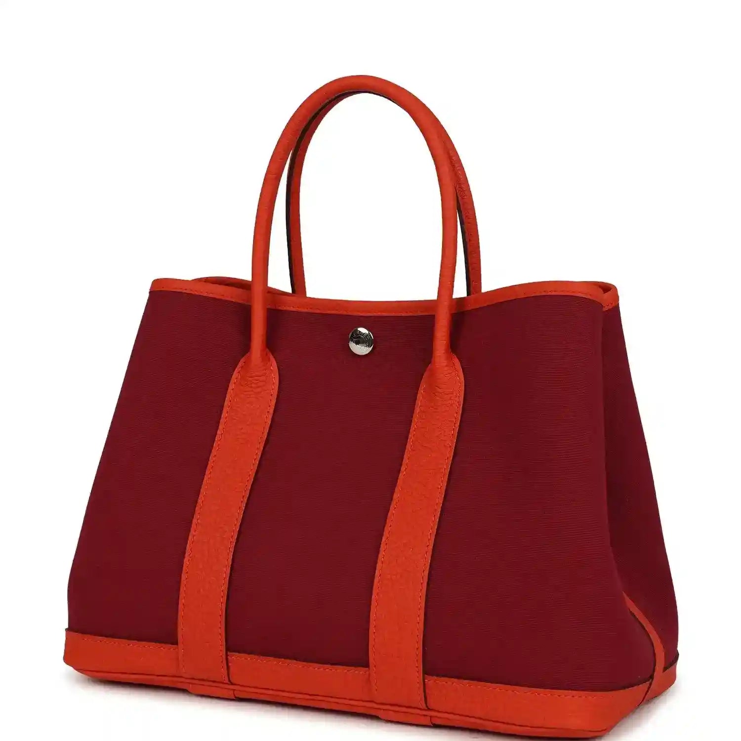 Rubis canvas tote bag with orange leather handles and rounded bottom edges