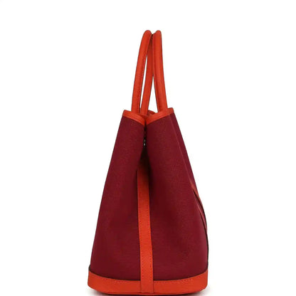 Rubis canvas tote bag with orange leather side panels and top handles