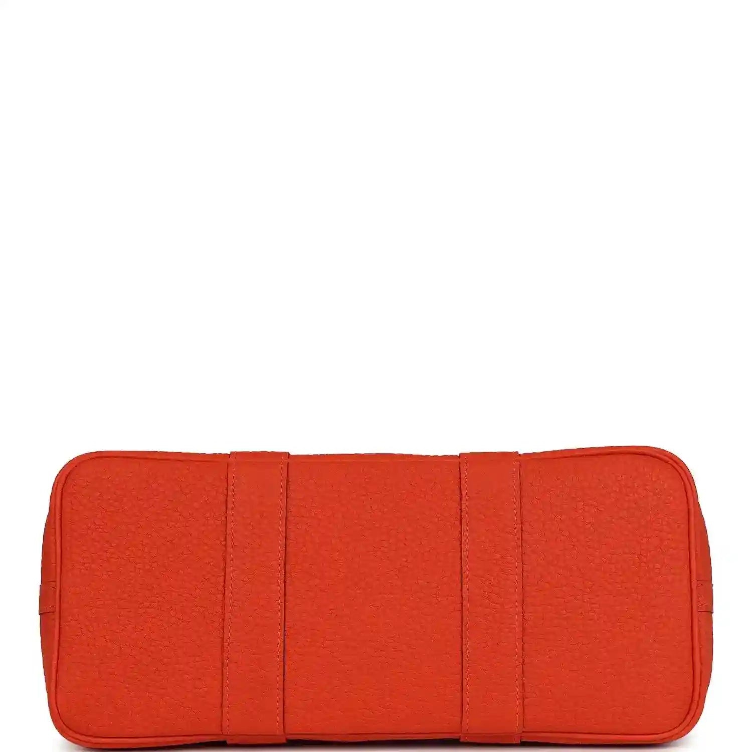 Orange leather base panel with stitched sections for a structured tote