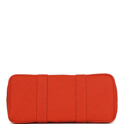 Orange leather base panel with stitched sections for a structured tote