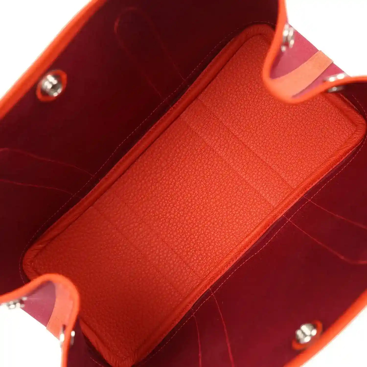 Rubis canvas tote interior with textured orange leather panel and silver hardware