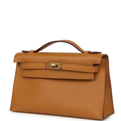 Tan leather Kelly pochette handbag, angled view with front flap and gold clasp