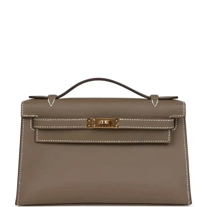 Hermes Kelly leather clutch, etoupe (taupe) with gold hardware and top handle