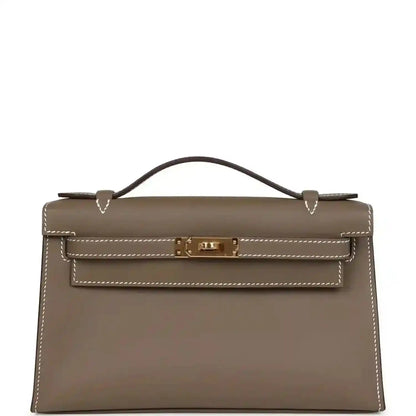 Hermes Kelly leather clutch, etoupe (taupe) with gold hardware and top handle