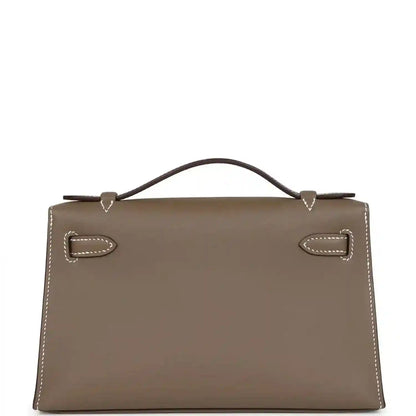 Hermes Kelly leather clutch front panel, etoupe with gold clasp and stitched edges