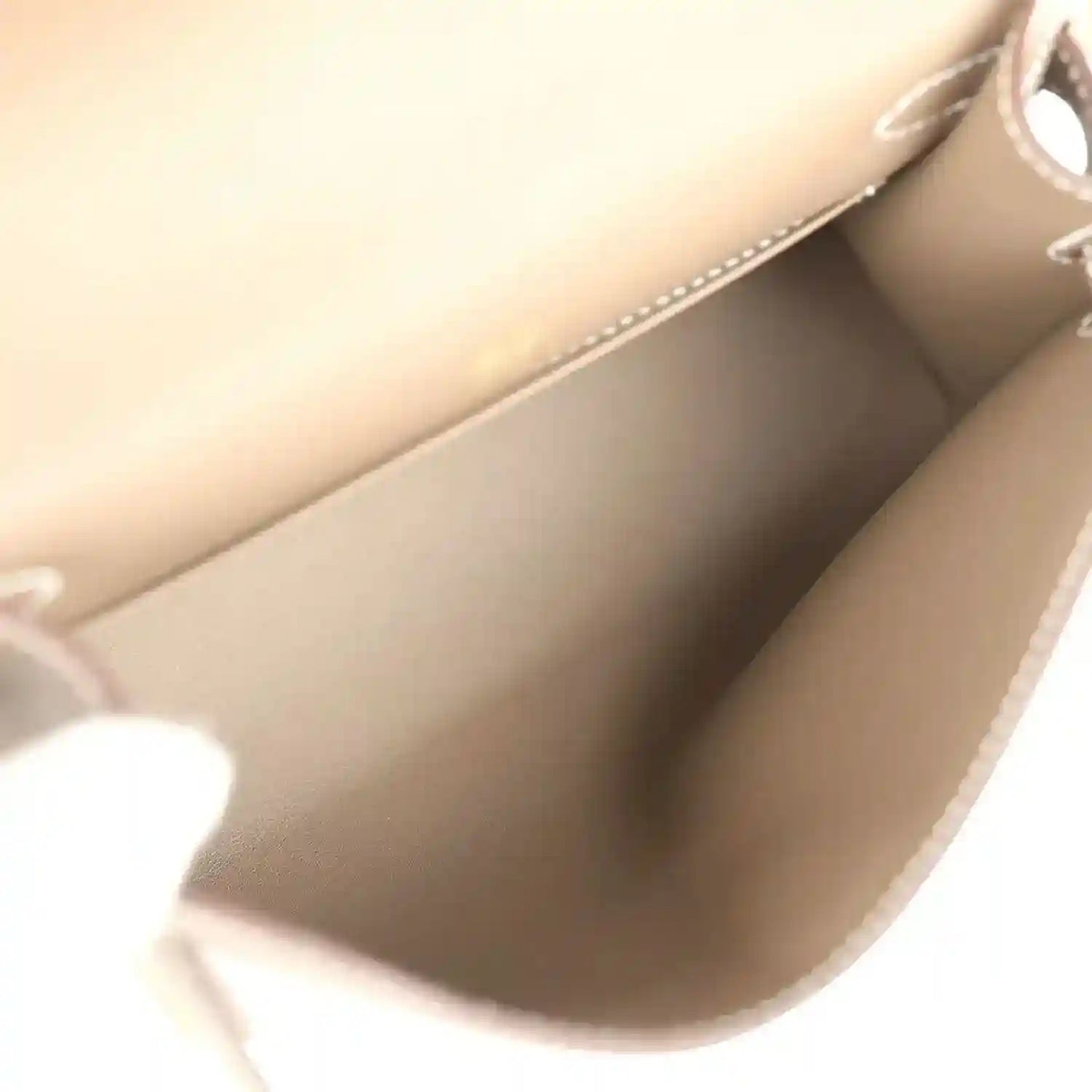 Hermes Kelly clutch interior lining in taupe with stitched edge seam
