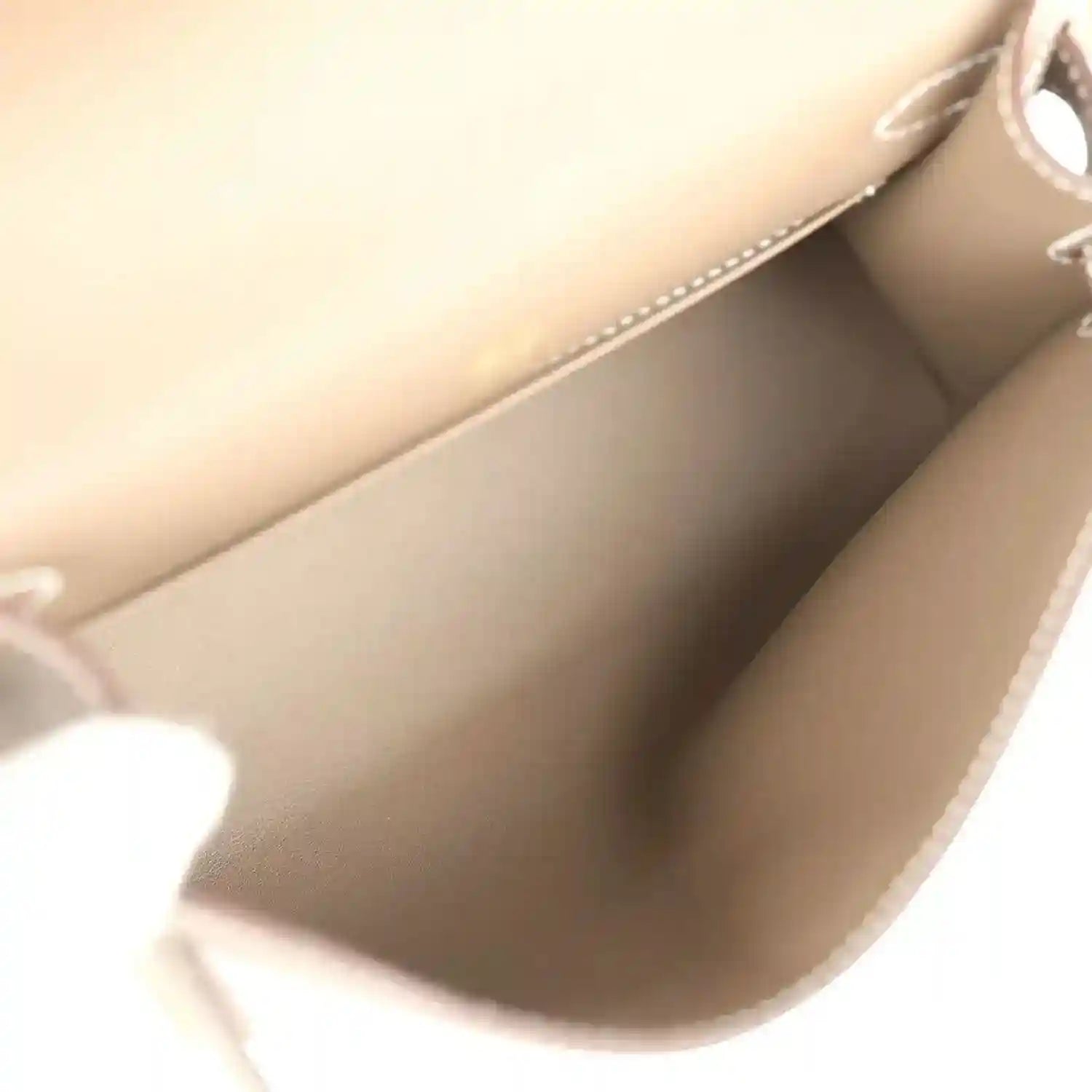 Hermes Kelly clutch interior lining in taupe with stitched edge seam