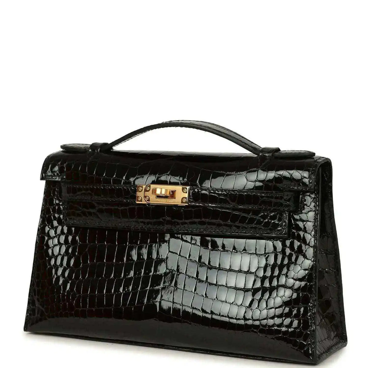 Black crocodile skin handbag with gold clasp, top handle, and embossed shine