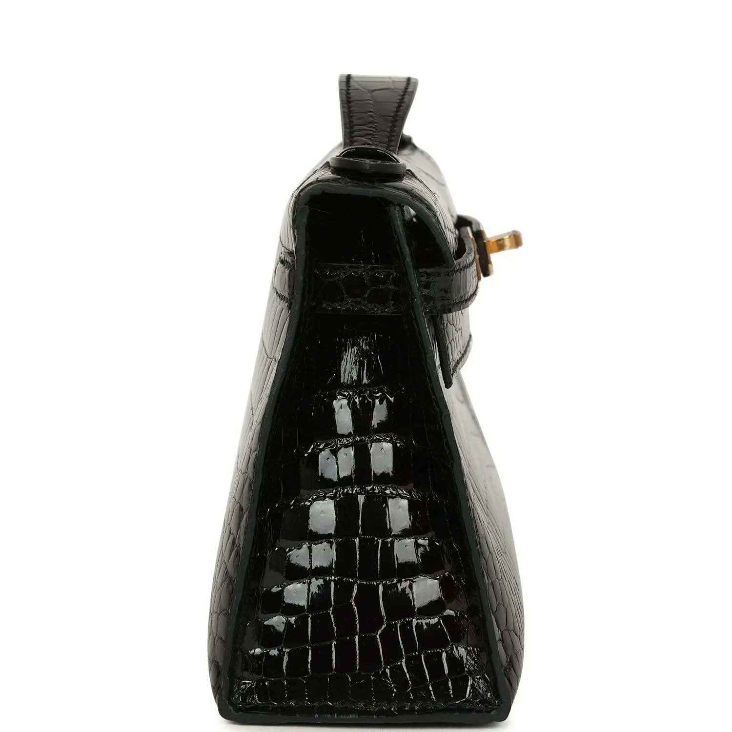 Black glossy crocodile skin mini handbag with raised top loop and gold hardware