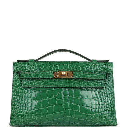 Hermes Kelly clutch in green shiny crocodile with gold front clasp and top handle
