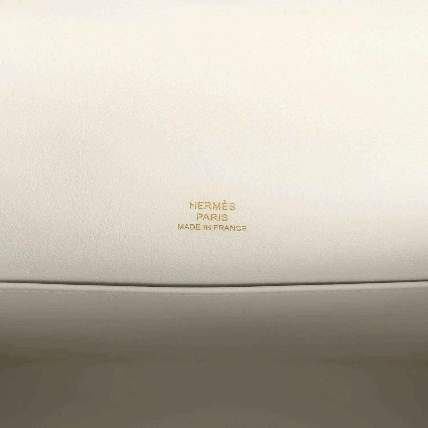 Hermès Paris Made in France leather stamp on light interior panel