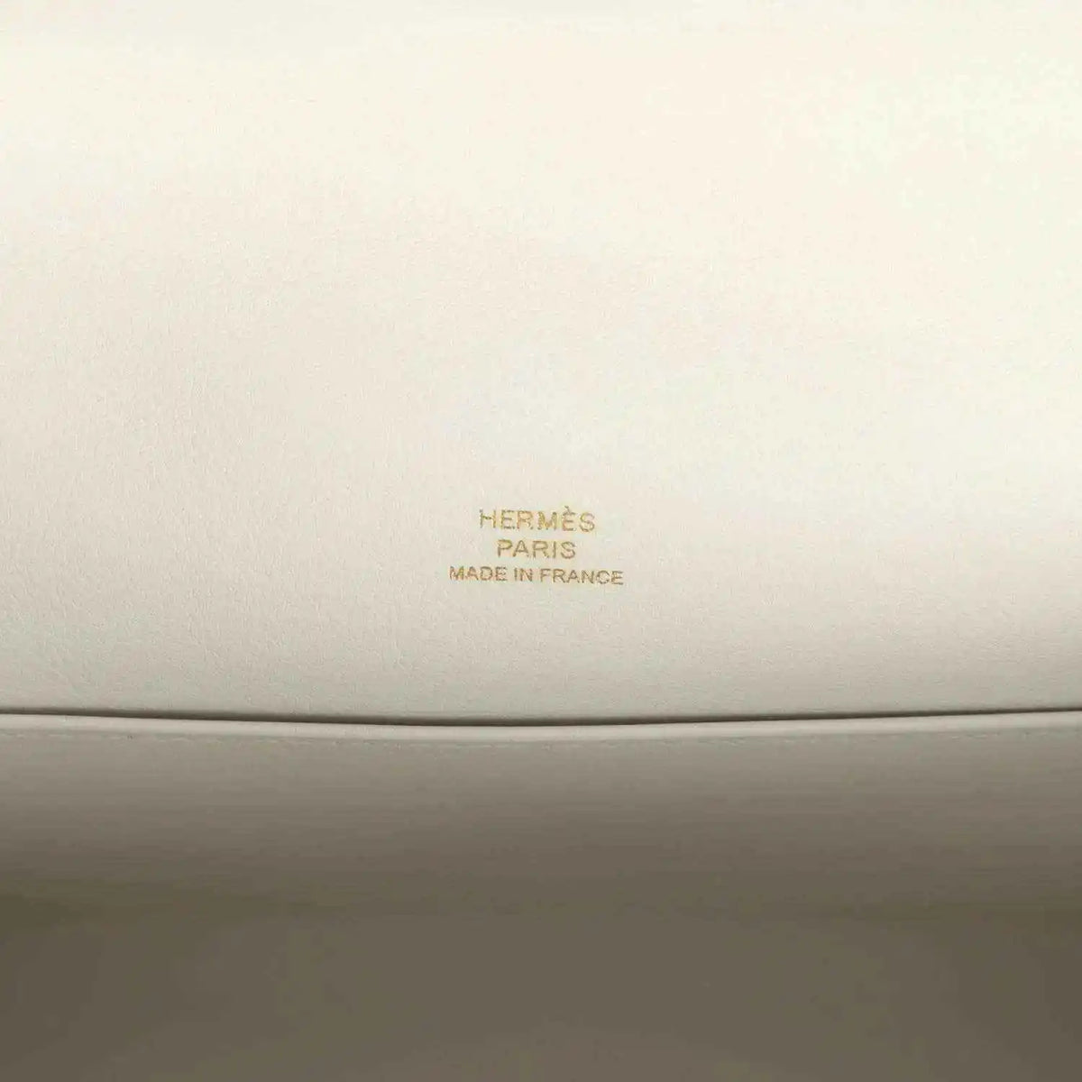 Hermès Paris Made in France leather stamp on light interior panel