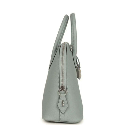 Light gray leather Bolide bag side view with zip top and lock charm detail