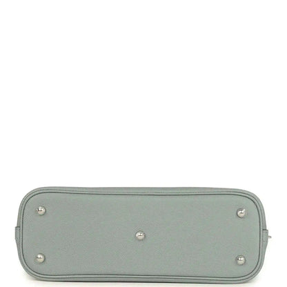 Light gray leather Bolide bag bottom with metal feet and stitched zip trim