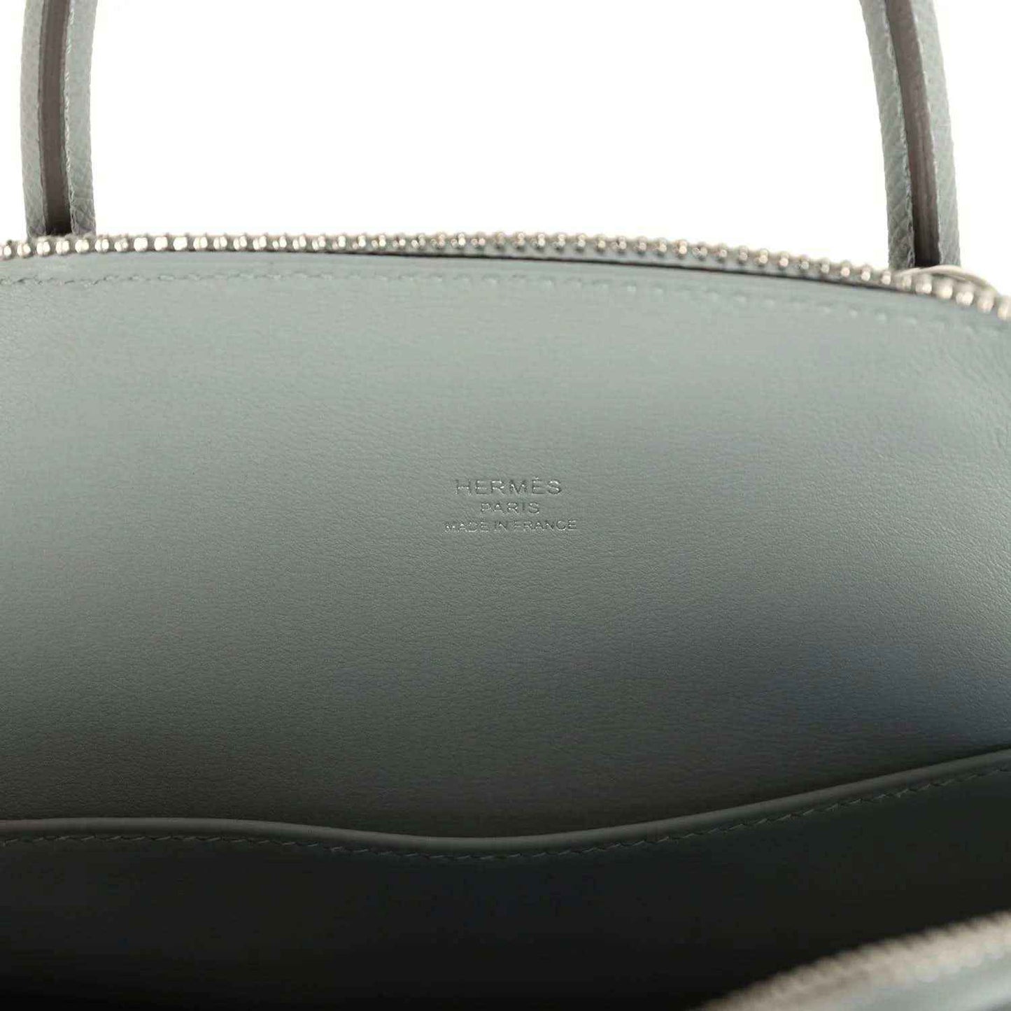 Light gray leather Bolide with embossed brand stamp on interior side