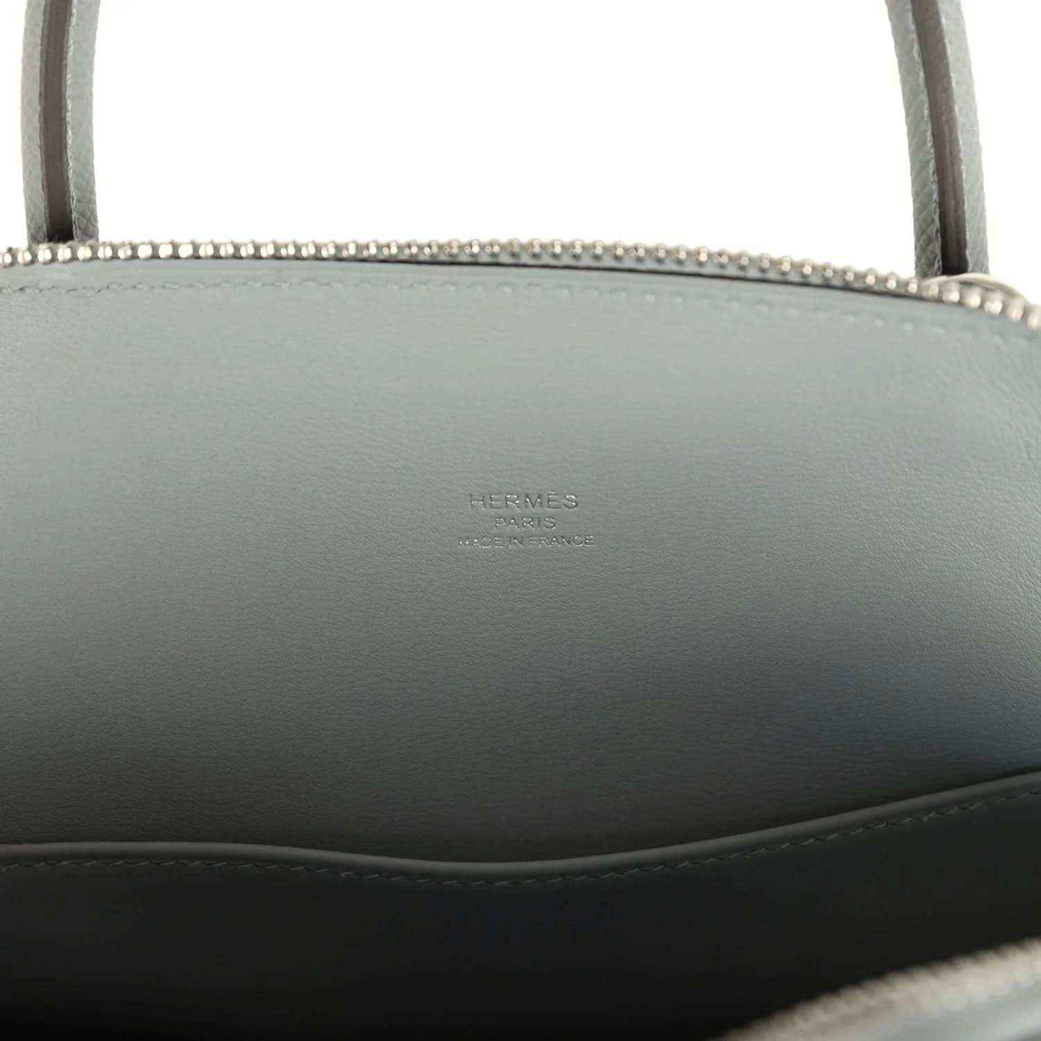 Light gray leather Bolide with embossed brand stamp on interior side