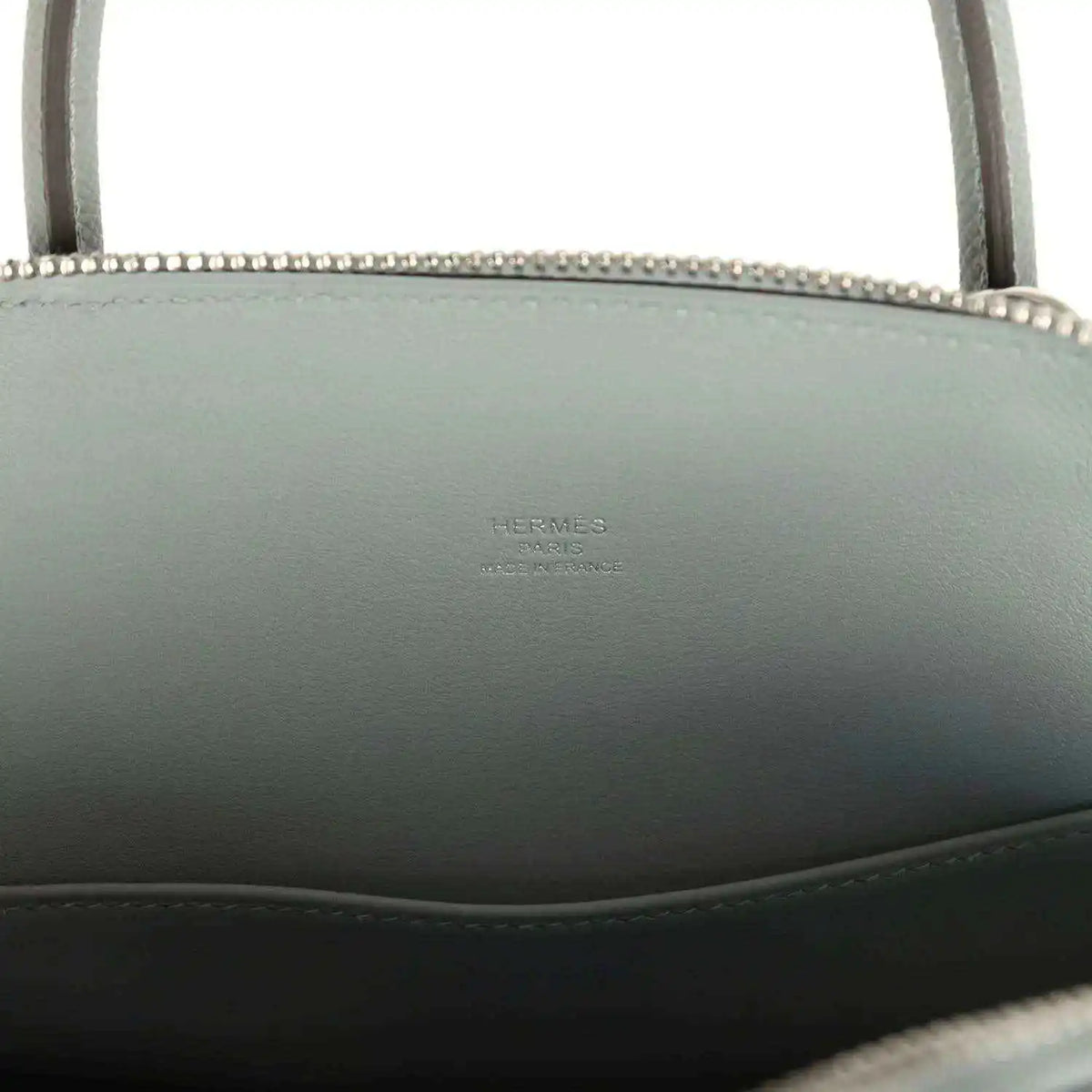 Light gray leather Bolide with embossed brand stamp on interior side