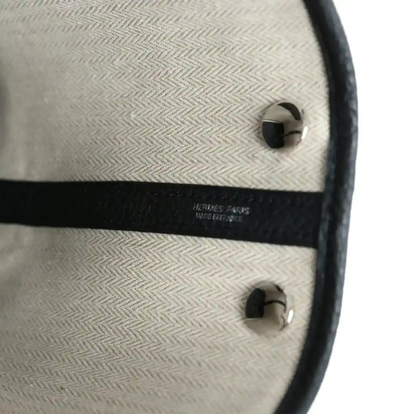 Hermes Paris stamp on tote bag interior lining with black trim