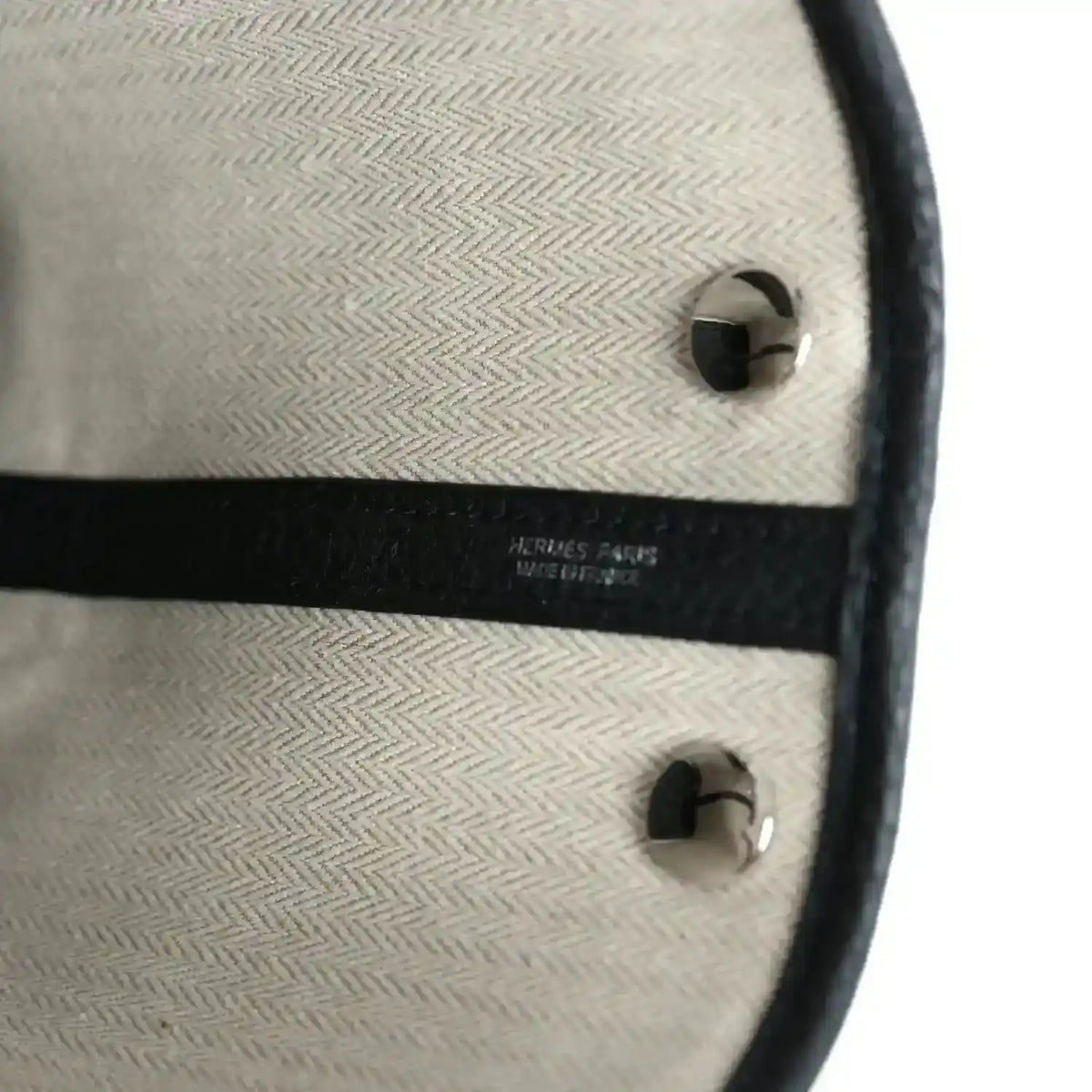 Hermes Paris stamp on tote bag interior lining with black trim