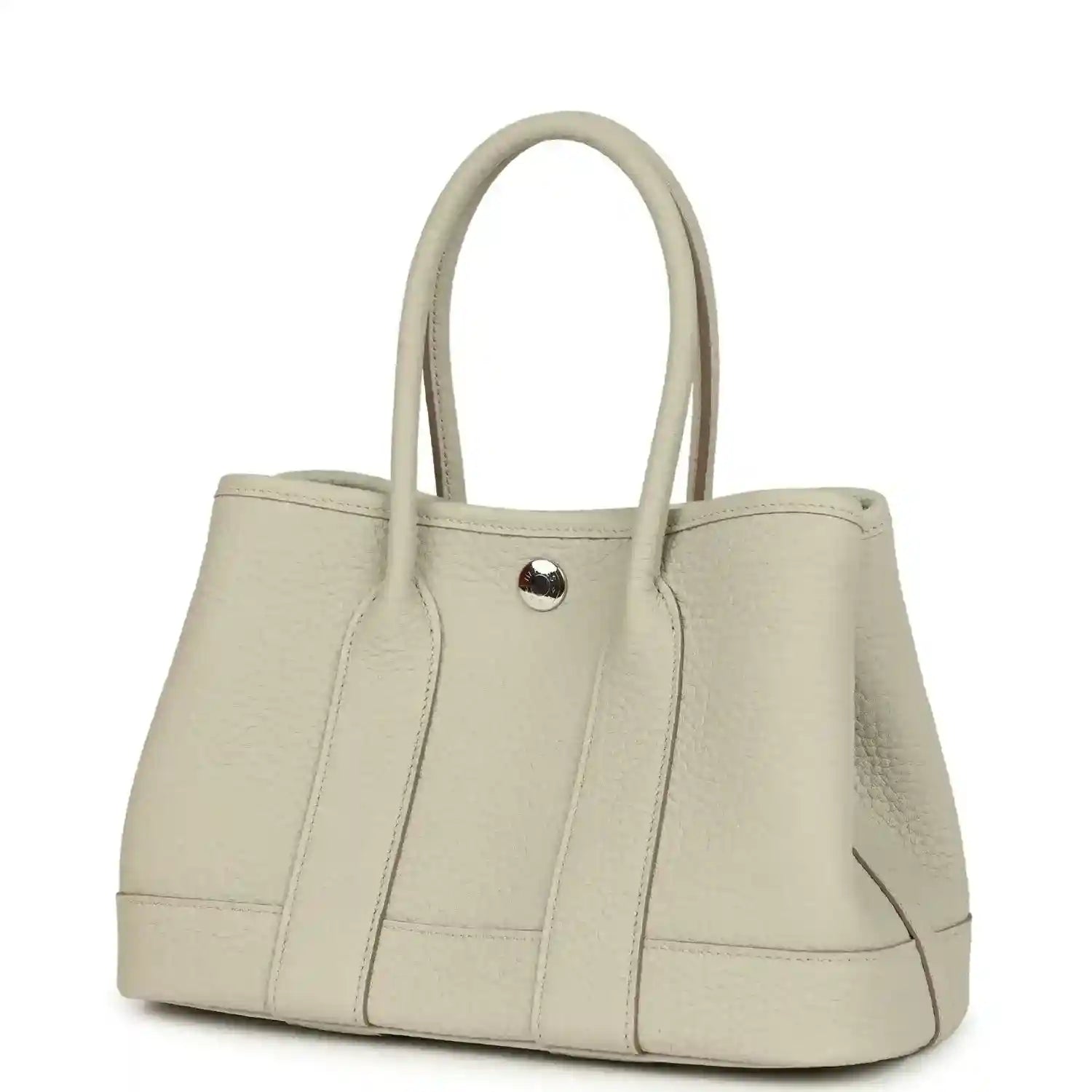 Hermes Garden Party Neo 23 tote bag angled view in light beige leather with front snap tab
