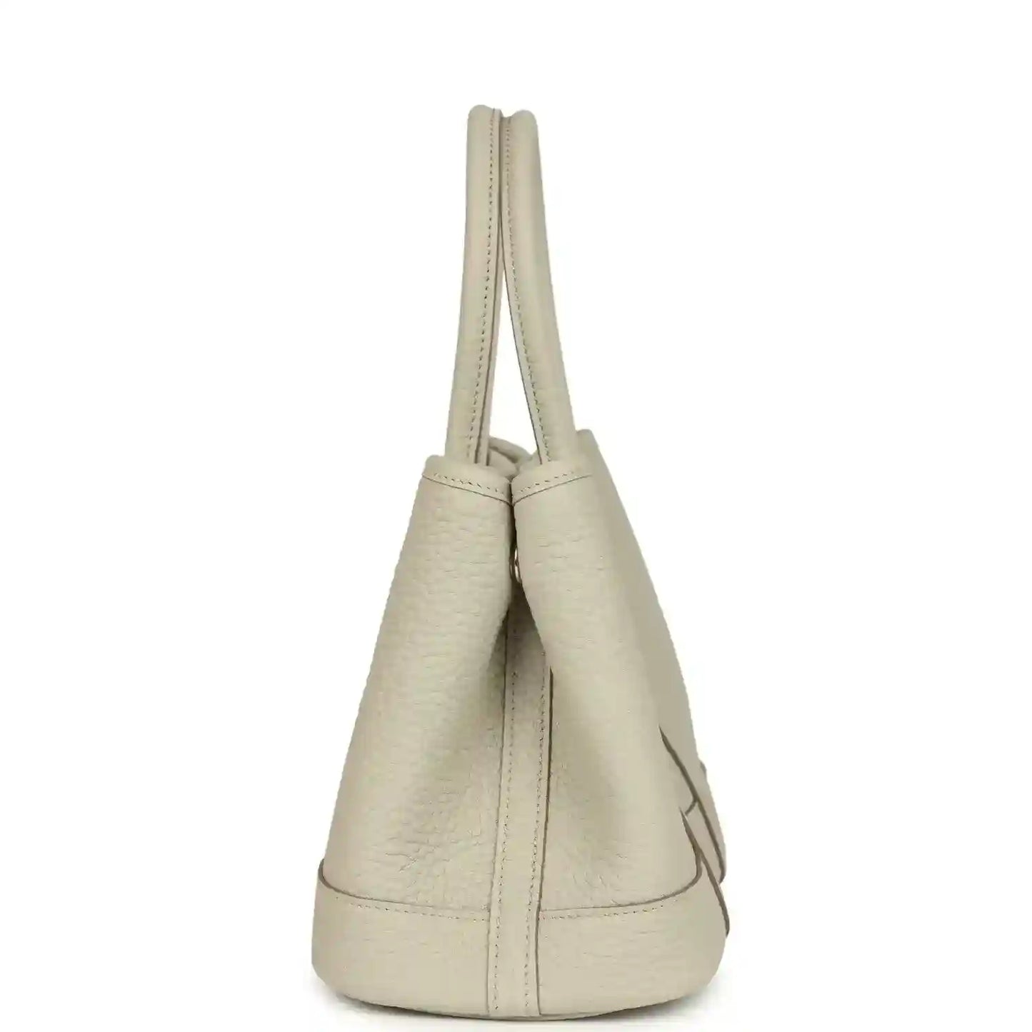 Hermes Garden Party Neo 23 tote bag side view in light beige leather with short handles and curved base