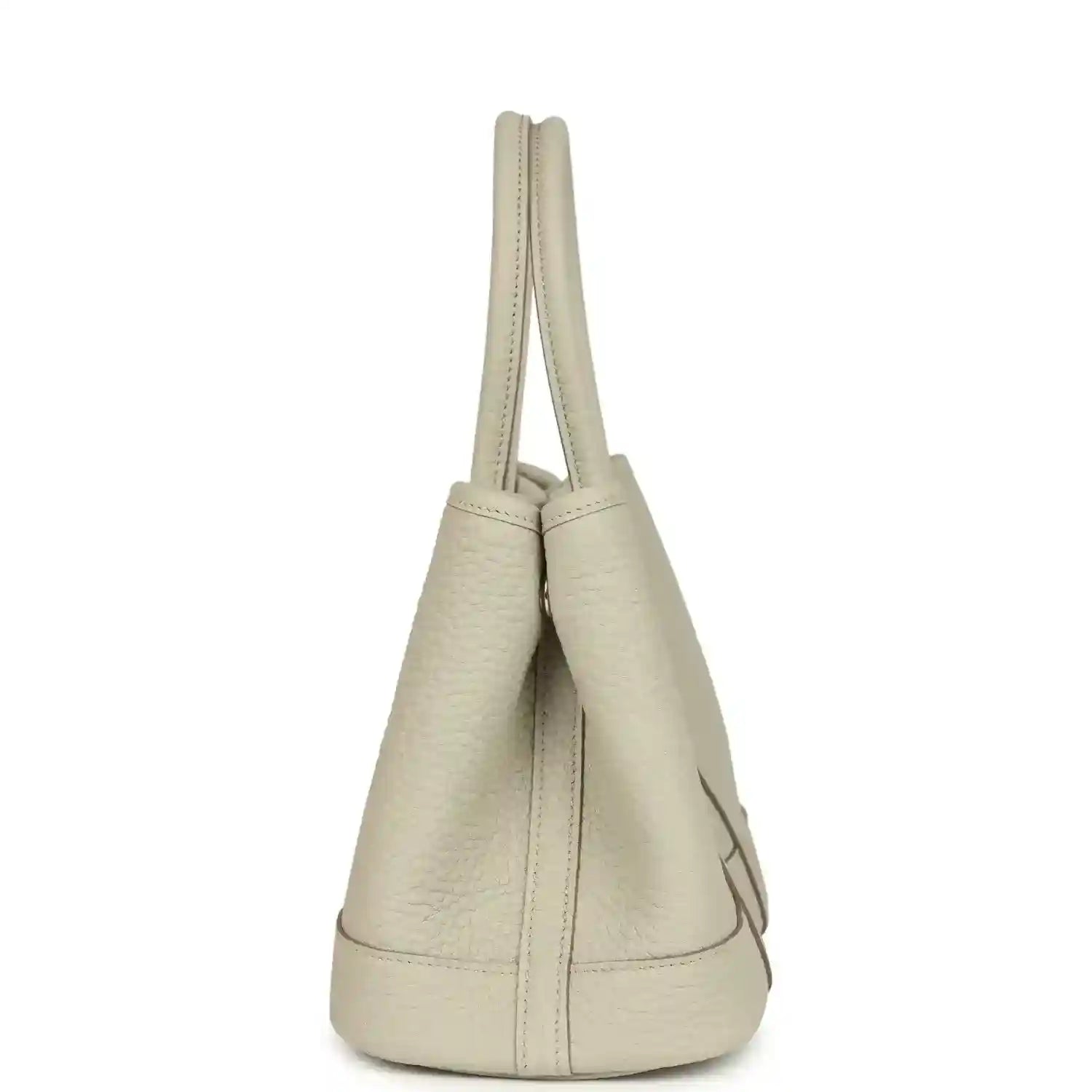 Hermes Garden Party Neo 23 tote bag side view in light beige leather with short handles and curved base