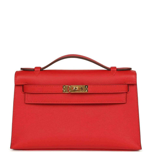 Red leather pochette with gold-tone clasp and top handle