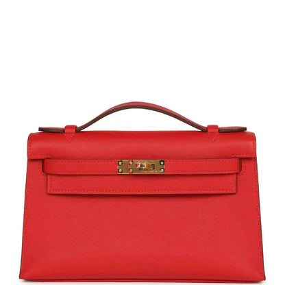 Red leather pochette with gold-tone clasp and top handle