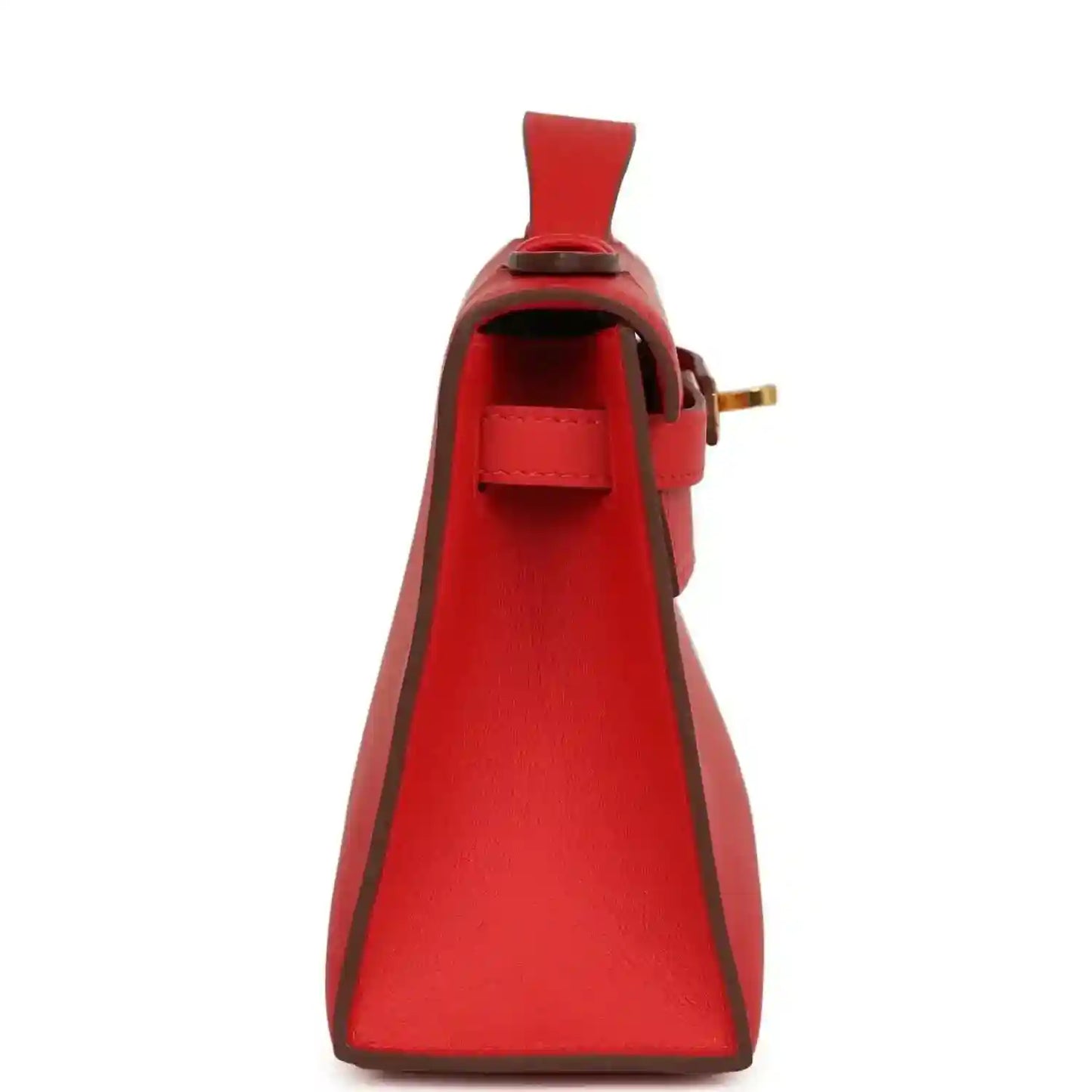 Red leather pochette with open interior, side strap, and gold buckle