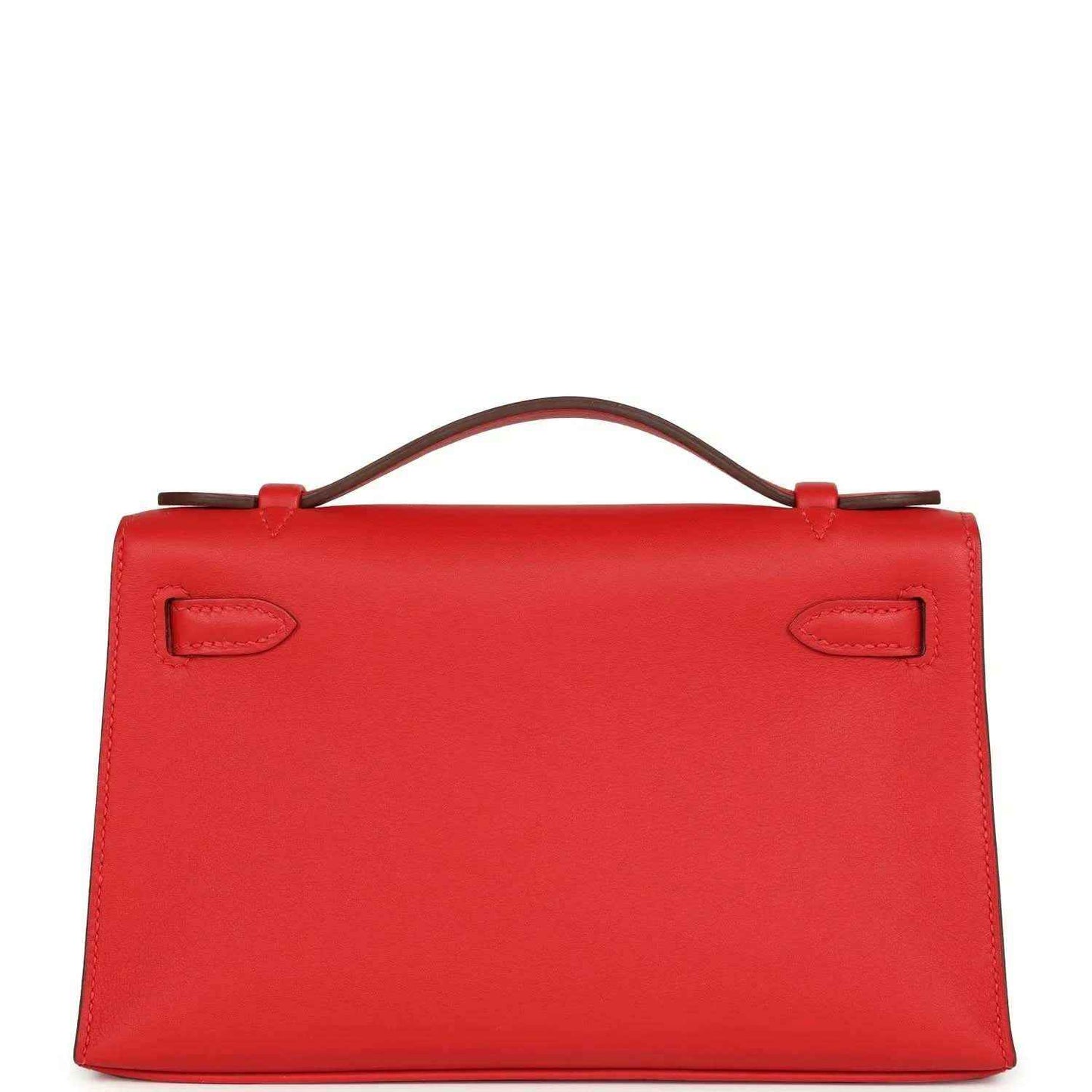 Red leather pochette back view with two embossed strap tabs and top handle