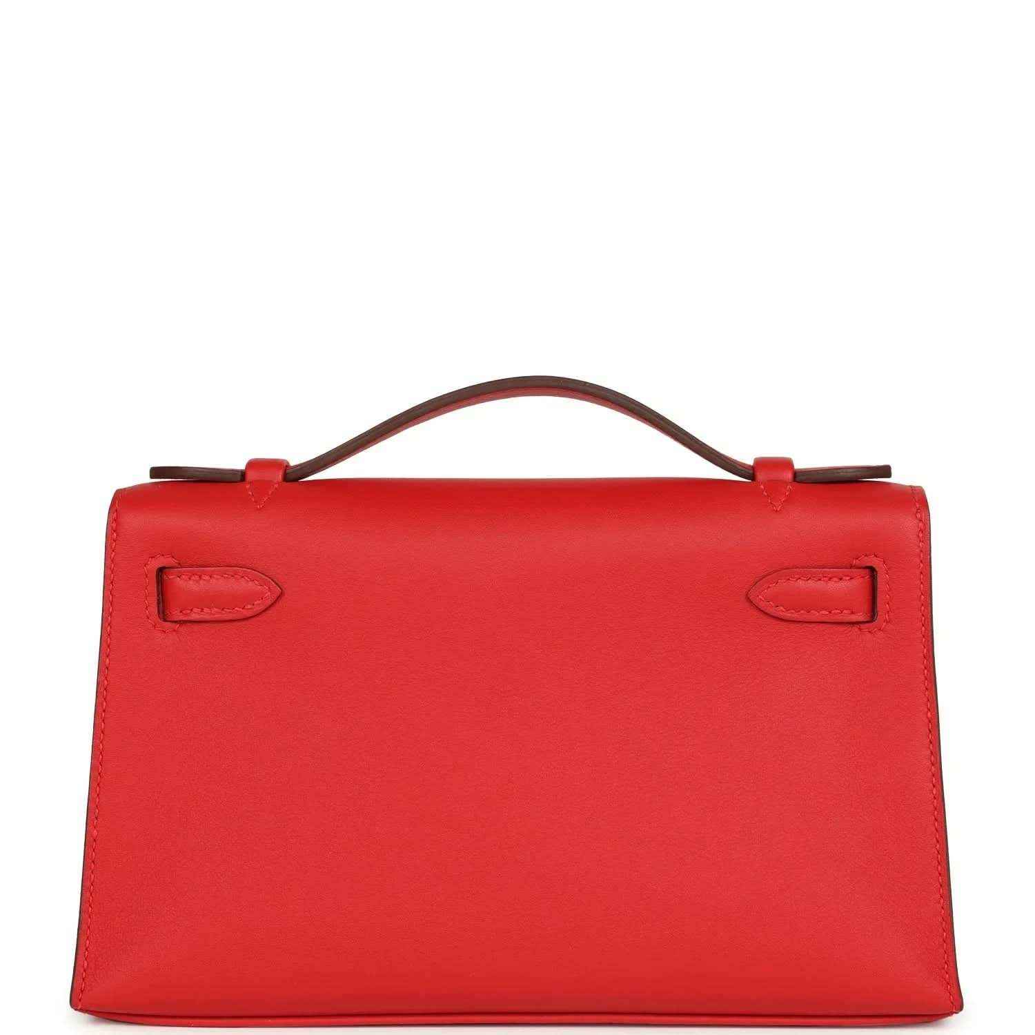 Red leather pochette back view with two embossed strap tabs and top handle