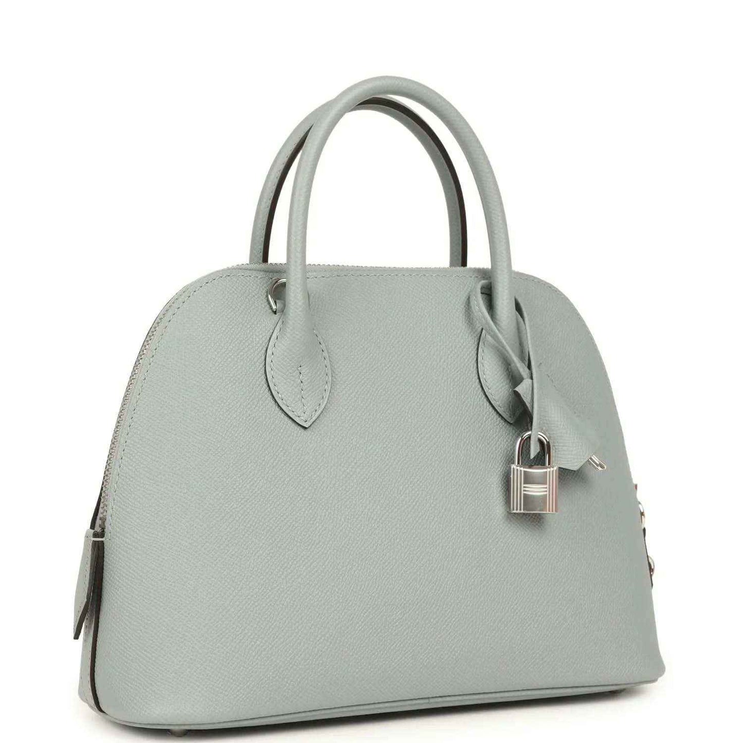 Light gray leather handbag with top handles and silver-tone lock detail, side view