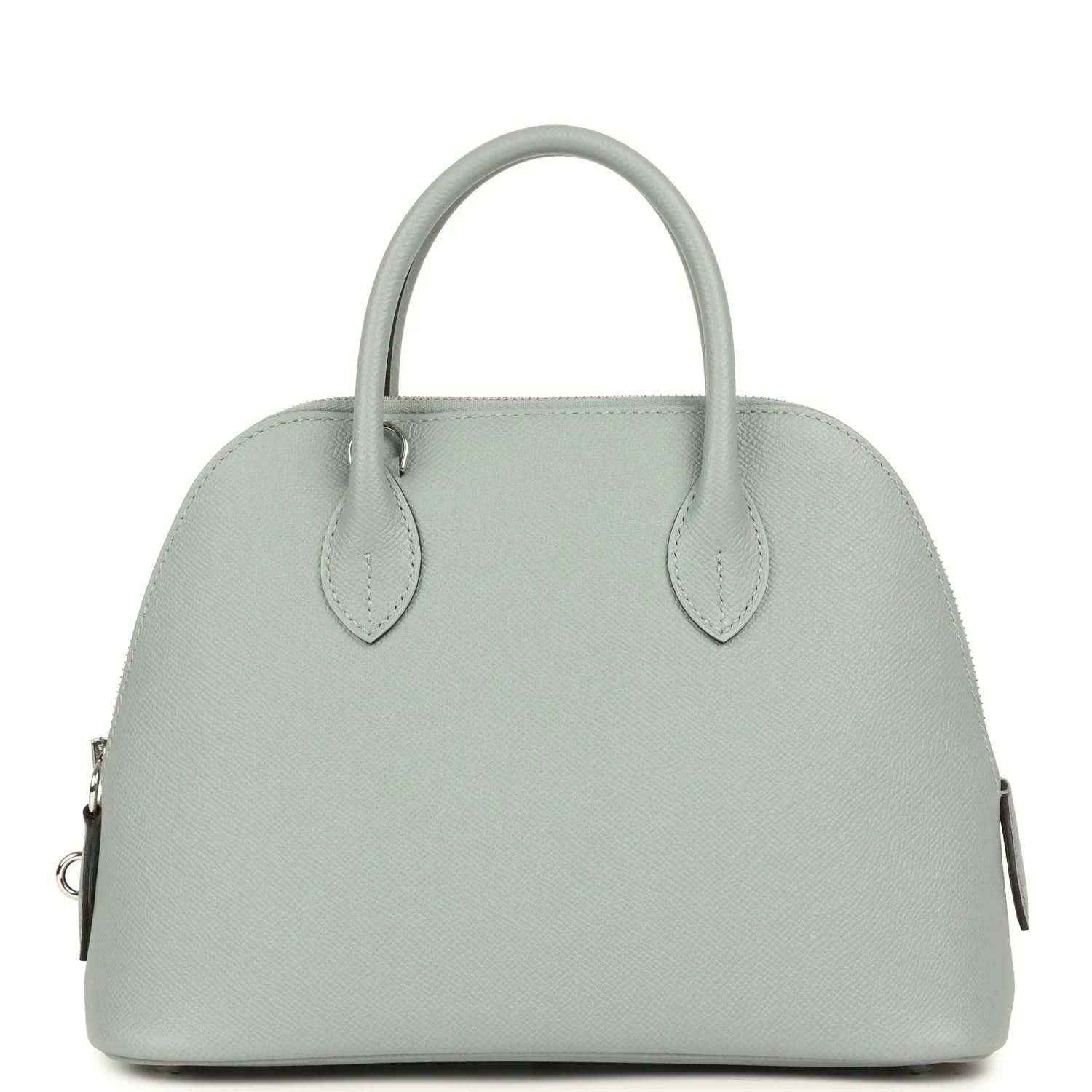 Light gray leather handbag front with two top handles and silver-tone hardware accents