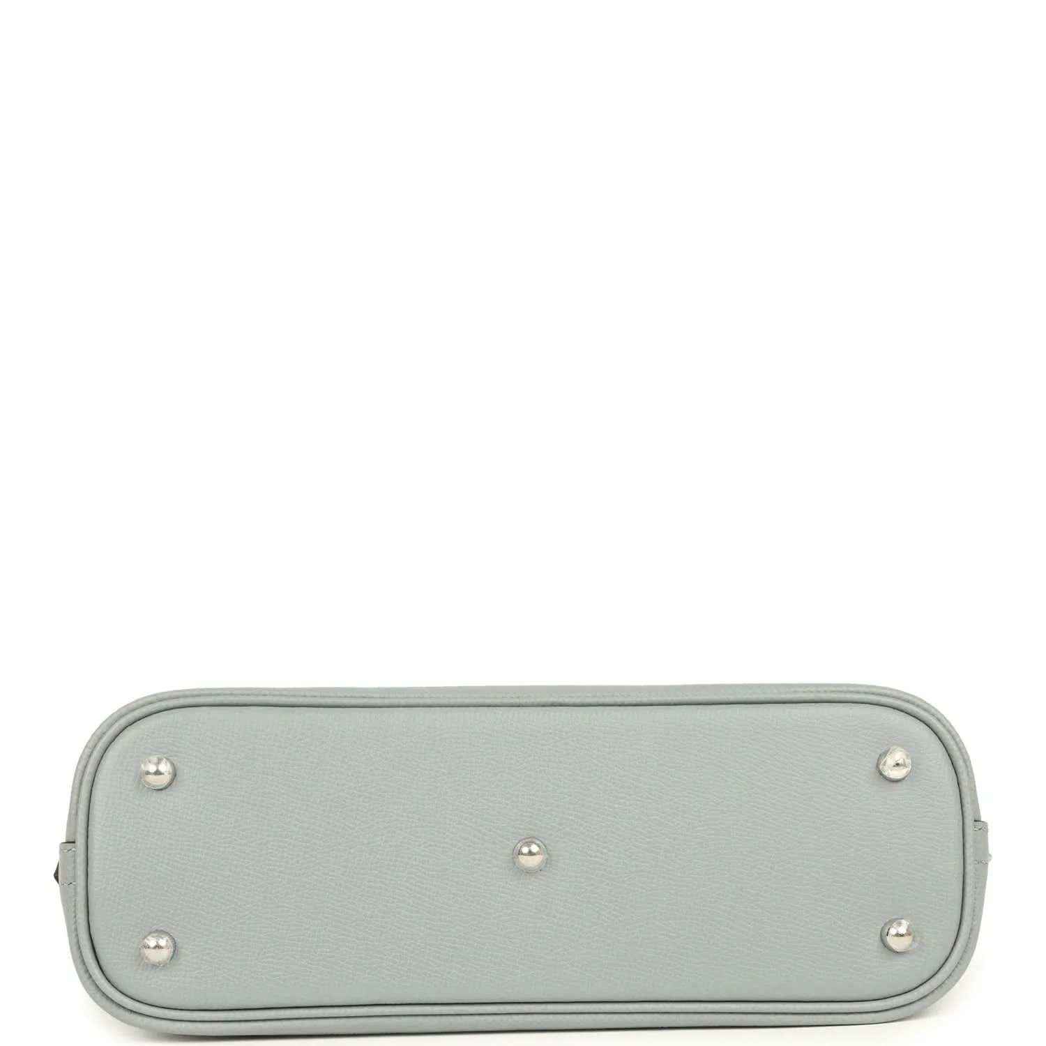 Light gray leather handbag base with four metal feet studs and rounded corners