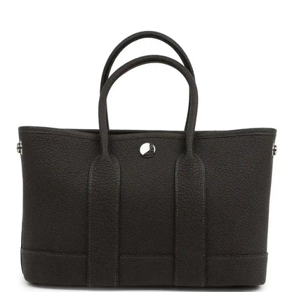 Leather tote bag with top handles, front patch pockets and center button
