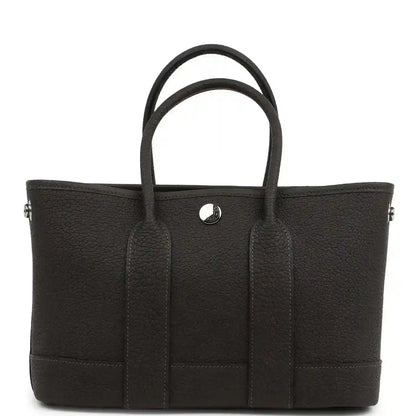 Leather tote bag with top handles, front patch pockets and center button