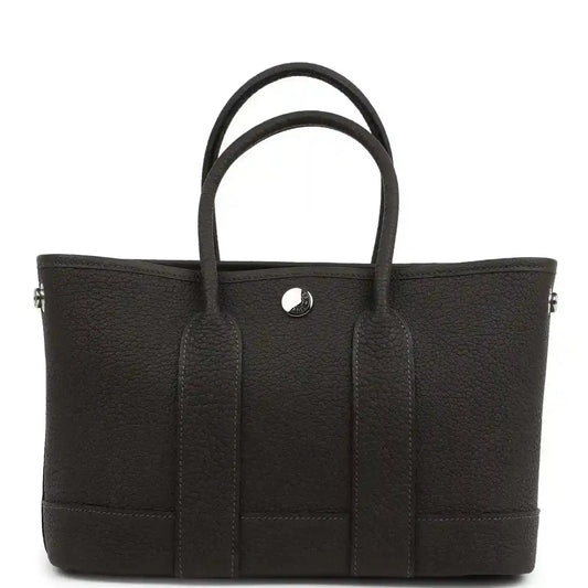 Leather tote bag with top handles, front patch pockets and center button