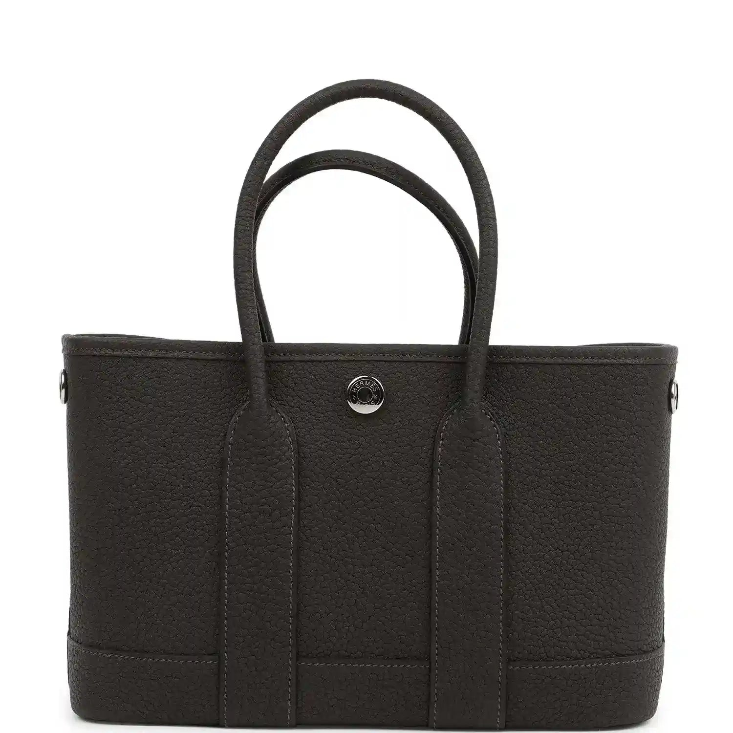 Leather tote bag with top handles and three front vertical panels, center snap