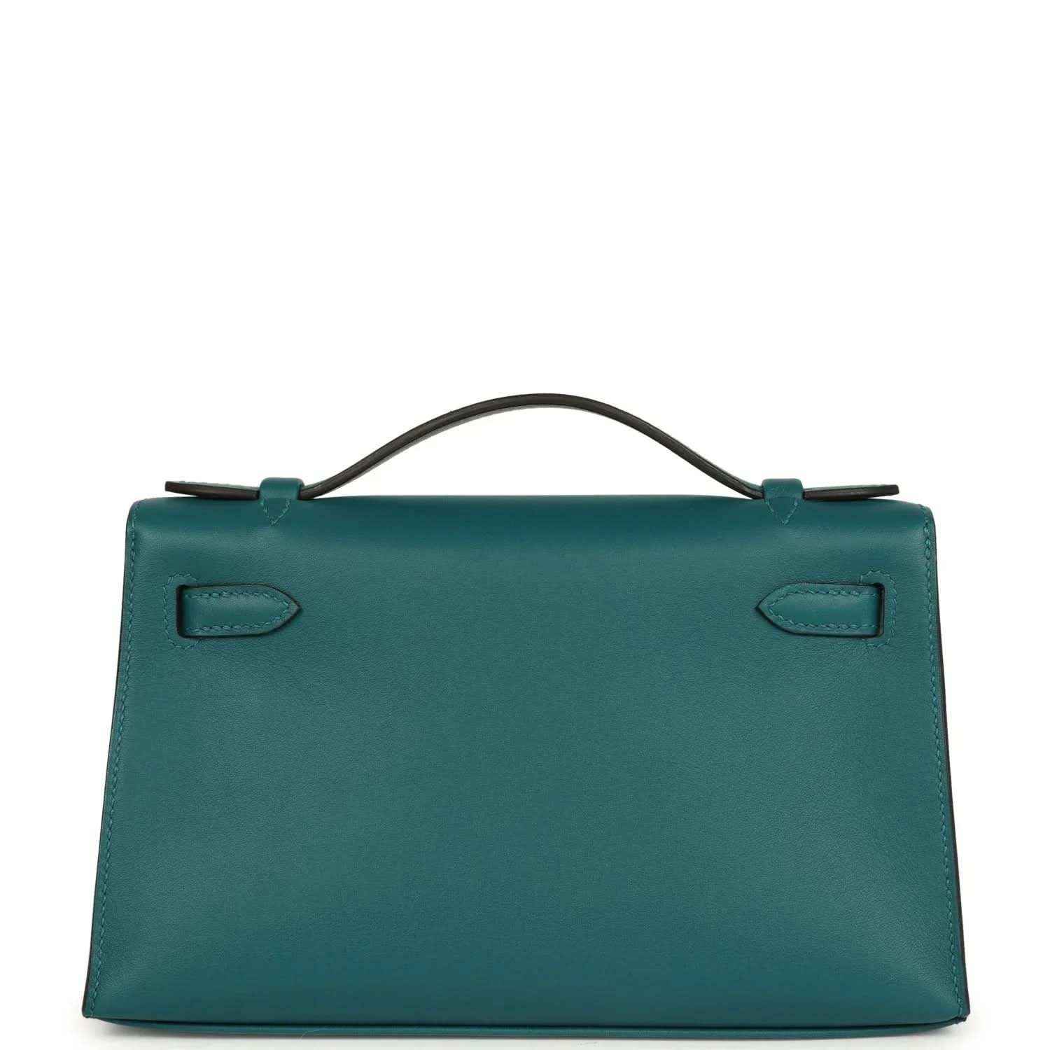 Teal green leather handbag with top handle and stitched corner tabs, back view.