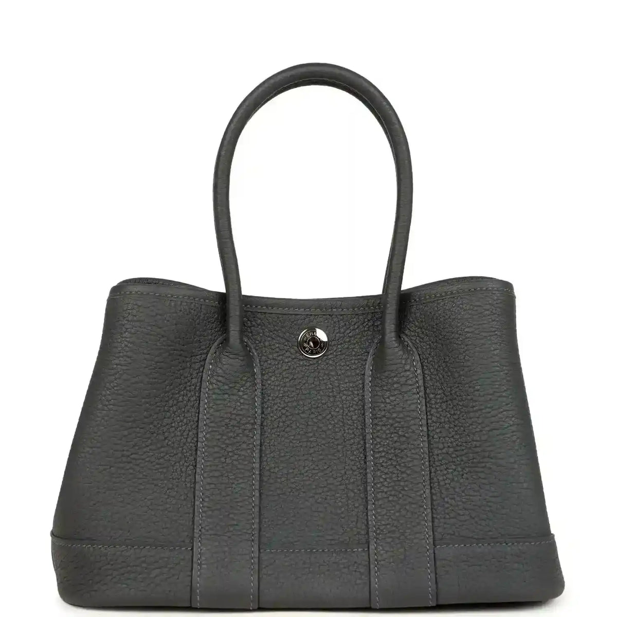 Dark gray leather tote bag with top handles and round front logo clasp